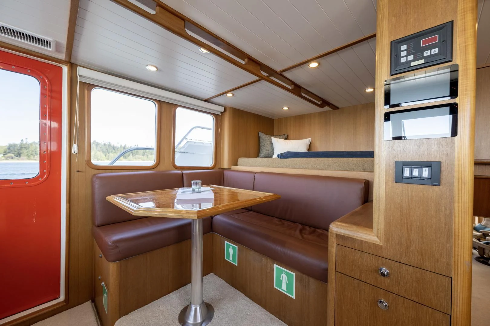a room with a table and couch aboard CHEEMAUN Yacht for Sale
