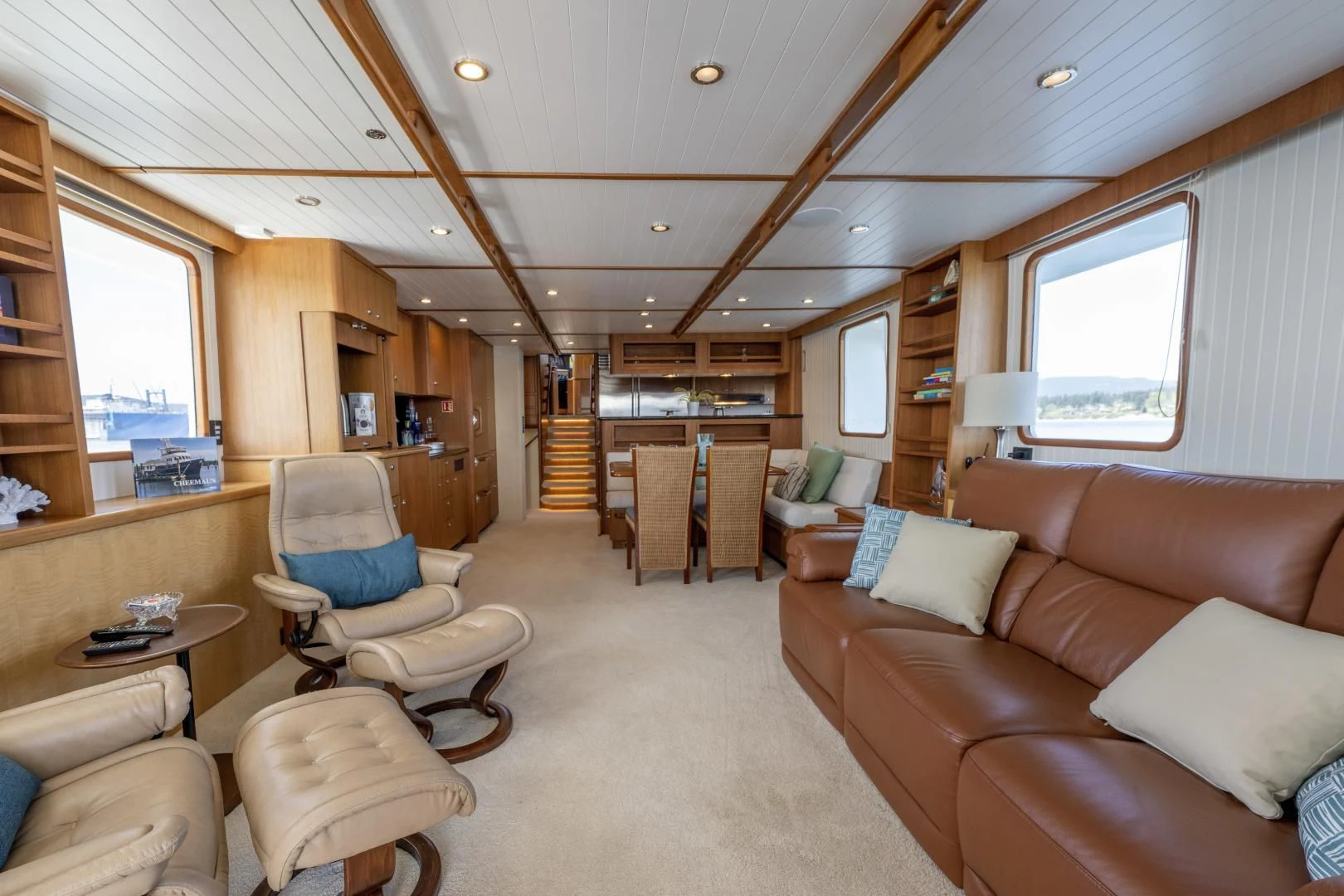 a living room with a couch and a table aboard CHEEMAUN Yacht for Sale