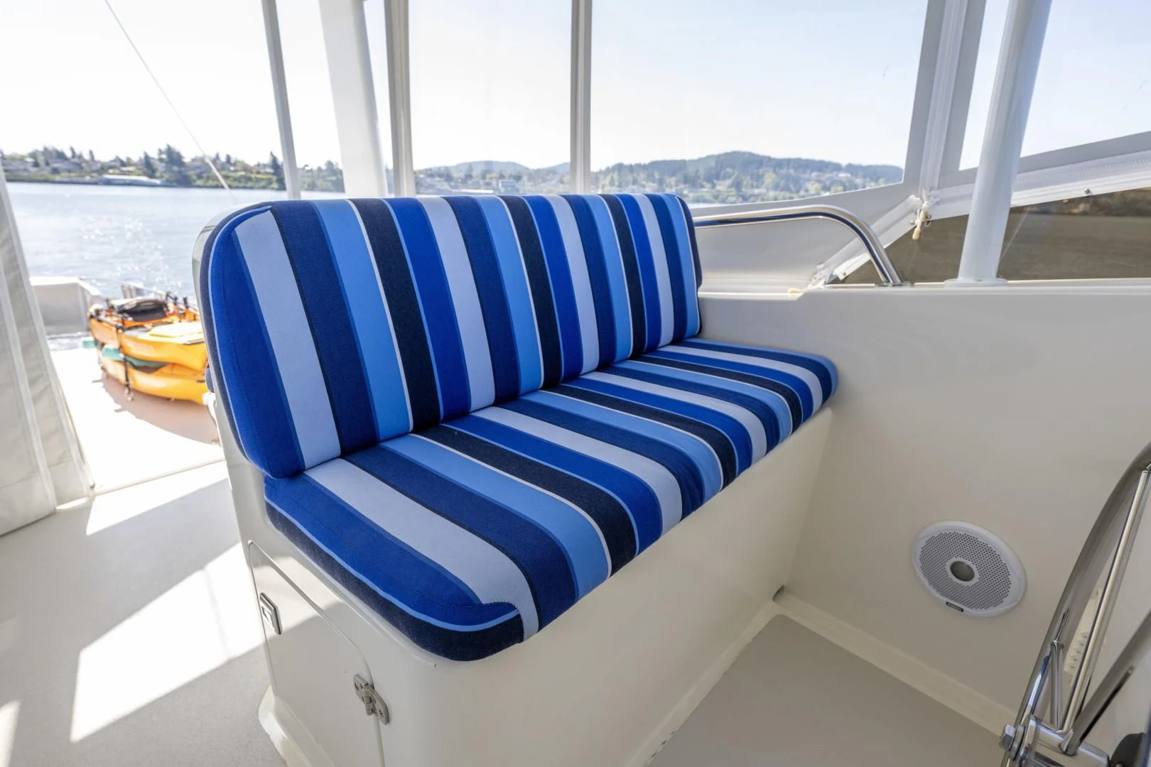 a blue and white chair on a boat aboard CHEEMAUN Yacht for Sale