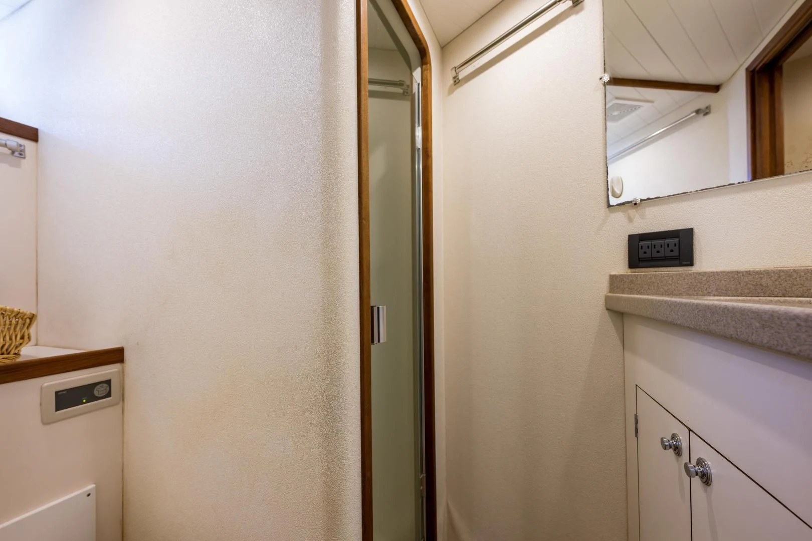 a bathroom with a sink and a mirror aboard CHEEMAUN Yacht for Sale