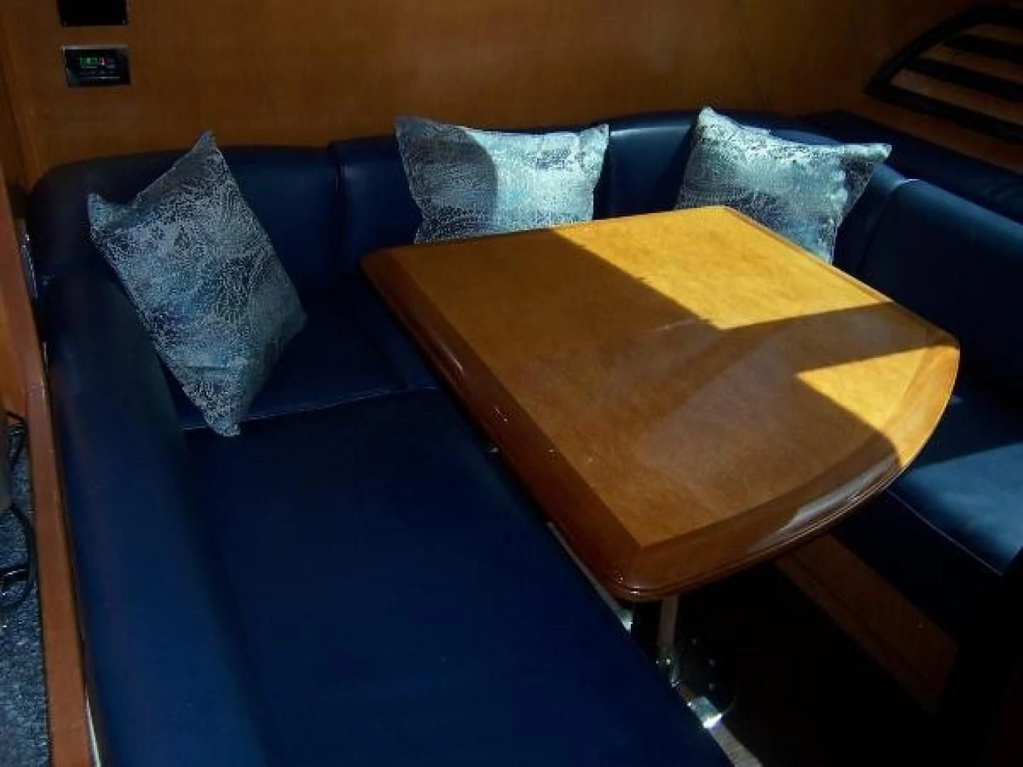 a wooden coffee table aboard UNZIPPED Yacht for Sale