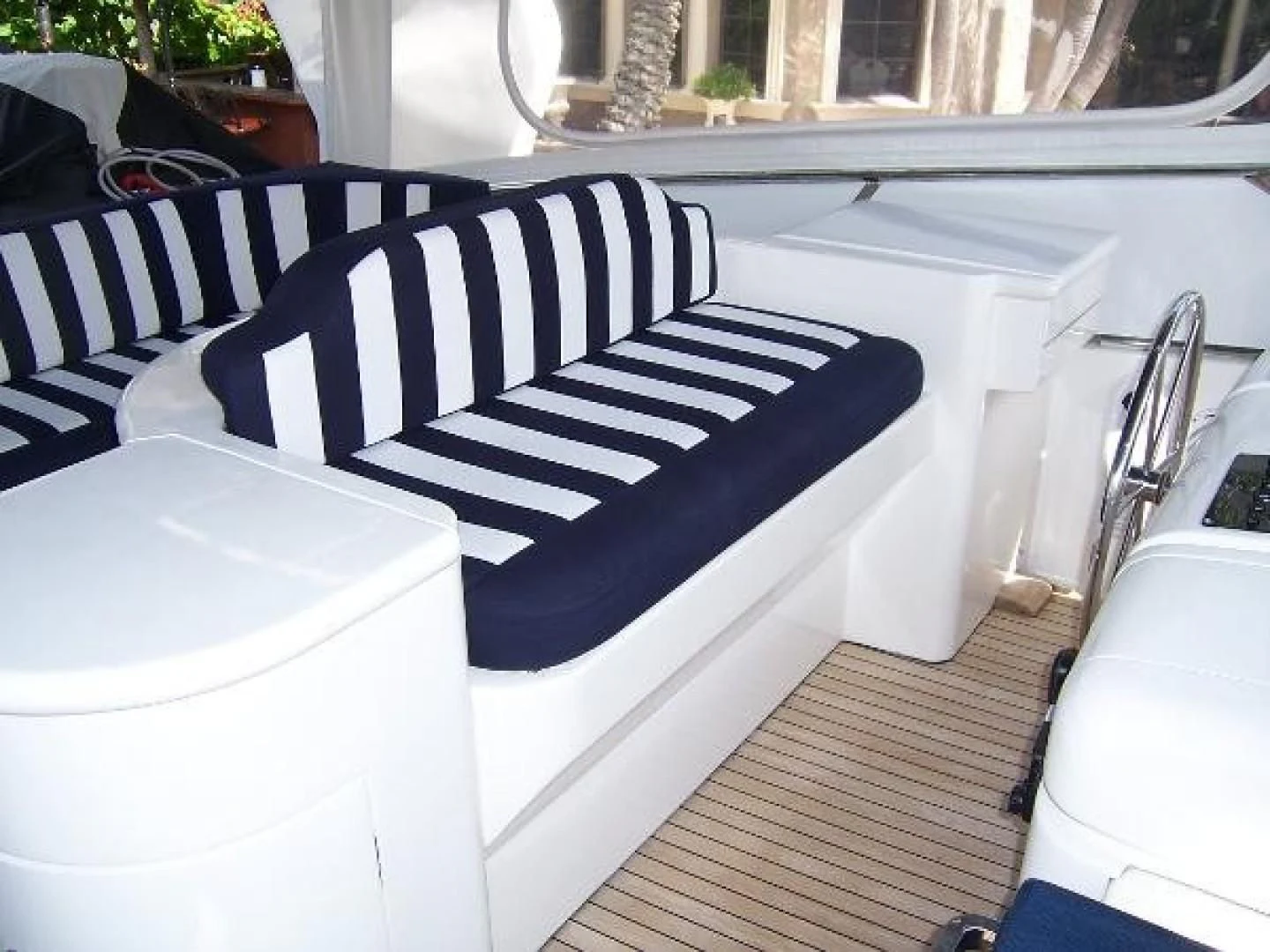a black and white striped chair aboard UNZIPPED Yacht for Sale