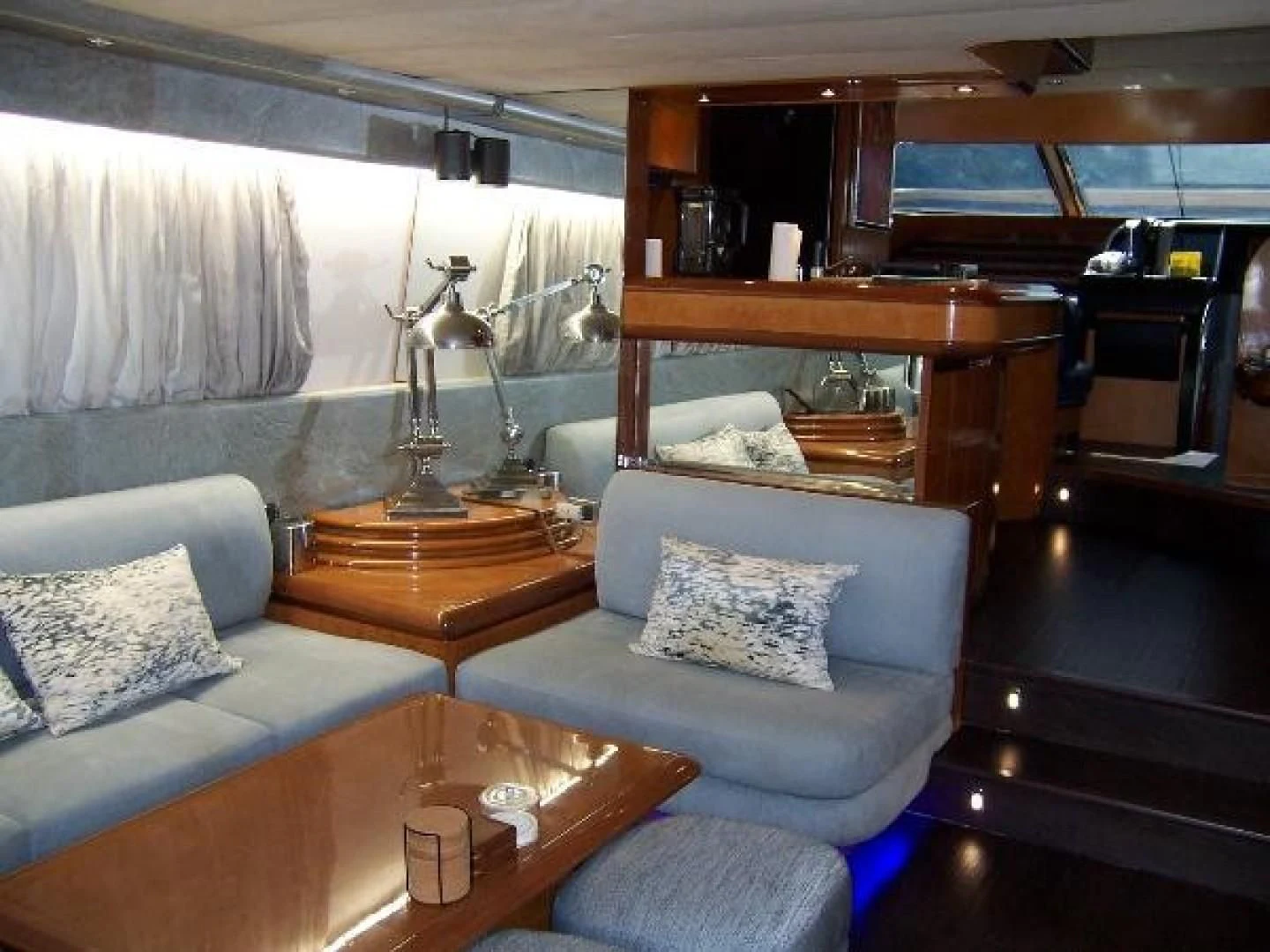 a room with a couch and a table aboard UNZIPPED Yacht for Sale