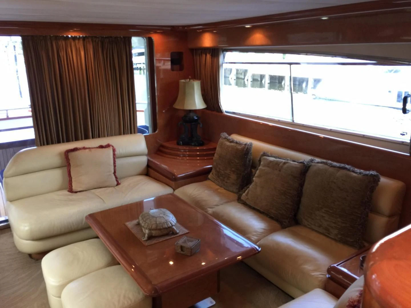 a living room with couches and a coffee table aboard UNZIPPED Yacht for Sale
