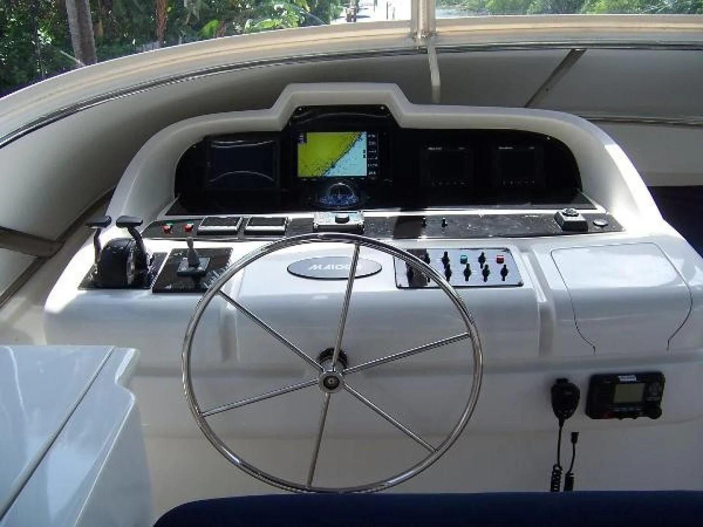 a white car with a steering wheel aboard UNZIPPED Yacht for Sale