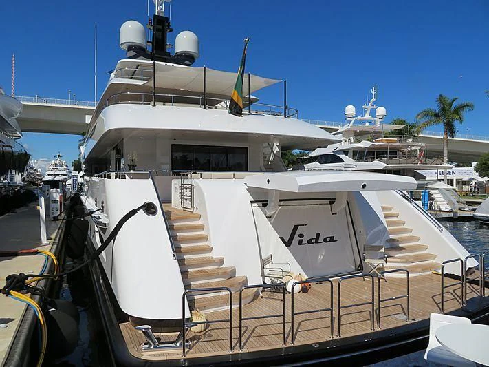 a boat docked at a pier aboard VIDA Yacht for Sale
