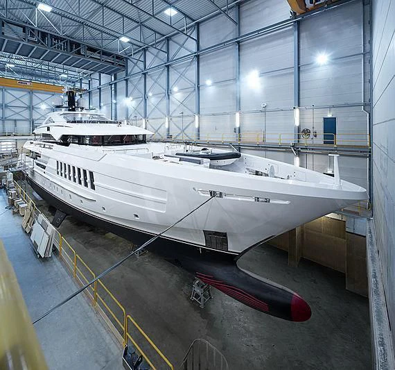 a large white boat in a large building aboard VIDA Yacht for Sale