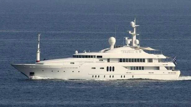 a large white ship in the water aboard PEARL Yacht for Sale