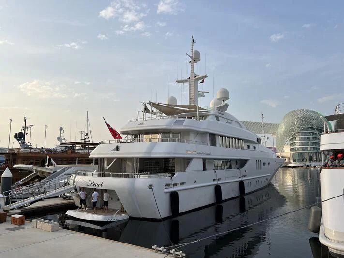 a large white boat docked aboard PEARL Yacht for Sale