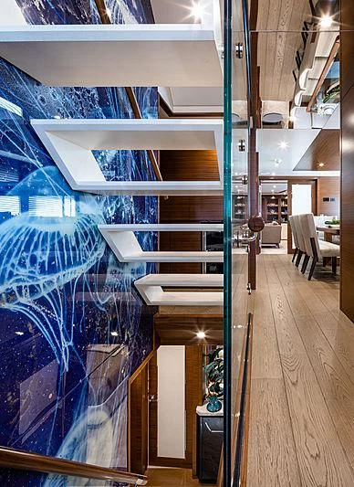 a room with a large blue wall aboard NORTHLAND Yacht for Sale