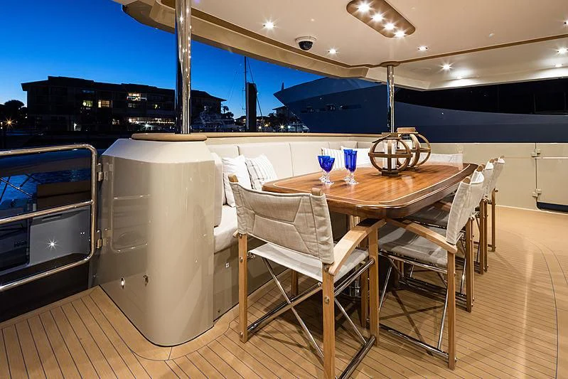 a table and chairs in a room aboard NORTHLAND Yacht for Sale