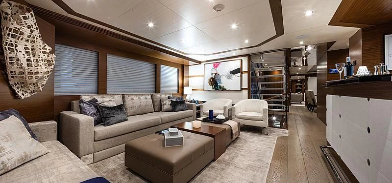 a living room with a large window aboard NORTHLAND Yacht for Sale