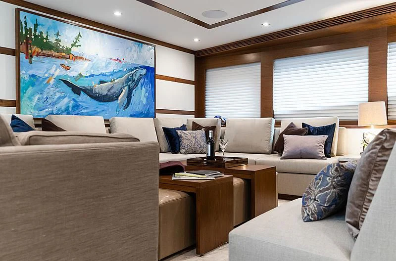 a living room with a couch and a table aboard NORTHLAND Yacht for Sale