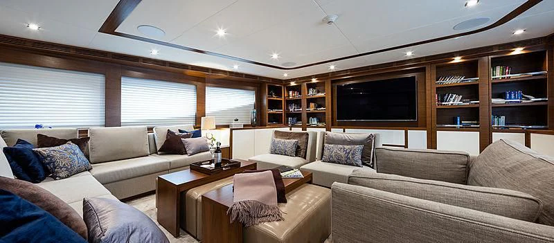 a living room with a couch and a tv aboard NORTHLAND Yacht for Sale