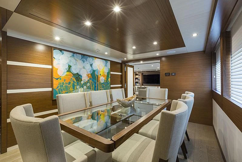 a room with a table chairs and a large window aboard NORTHLAND Yacht for Sale