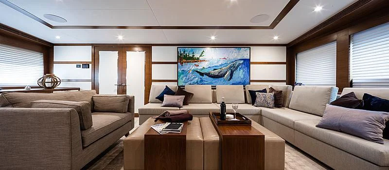 a living room with a couch and a coffee table aboard NORTHLAND Yacht for Sale