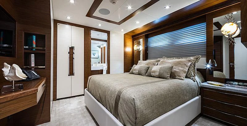 a bedroom with a bed and a desk aboard NORTHLAND Yacht for Sale