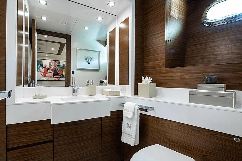 a bathroom with a large mirror aboard NORTHLAND Yacht for Sale