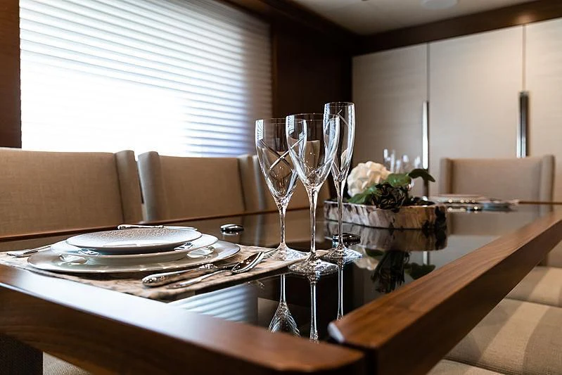 a table with plates and glasses on it aboard NORTHLAND Yacht for Sale