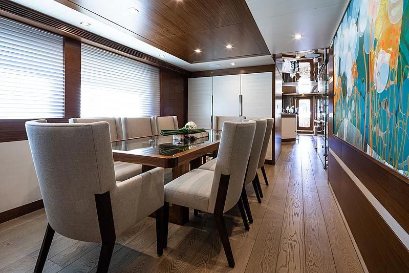 a room with a table chairs and a window aboard NORTHLAND Yacht for Sale