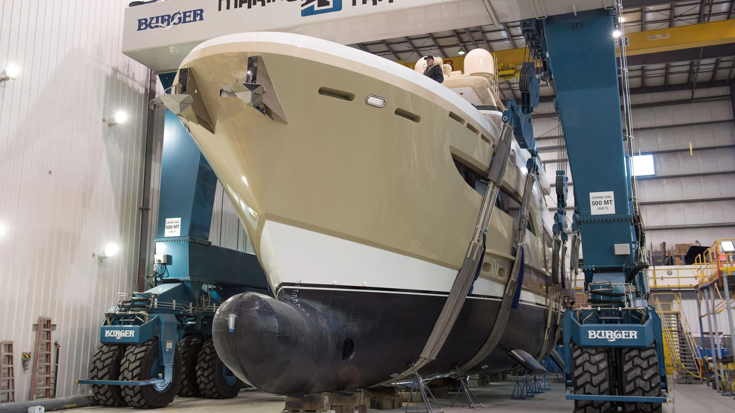 a large silver airplane in a warehouse aboard NORTHLAND Yacht for Sale
