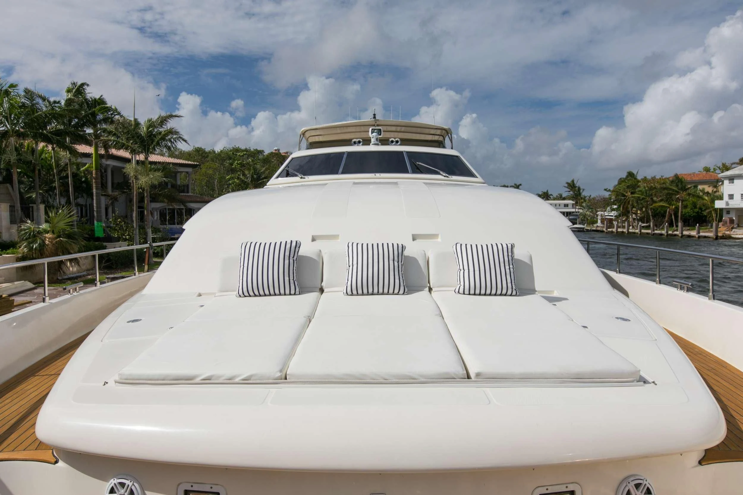 a white car on a road aboard MAMBO Yacht for Sale