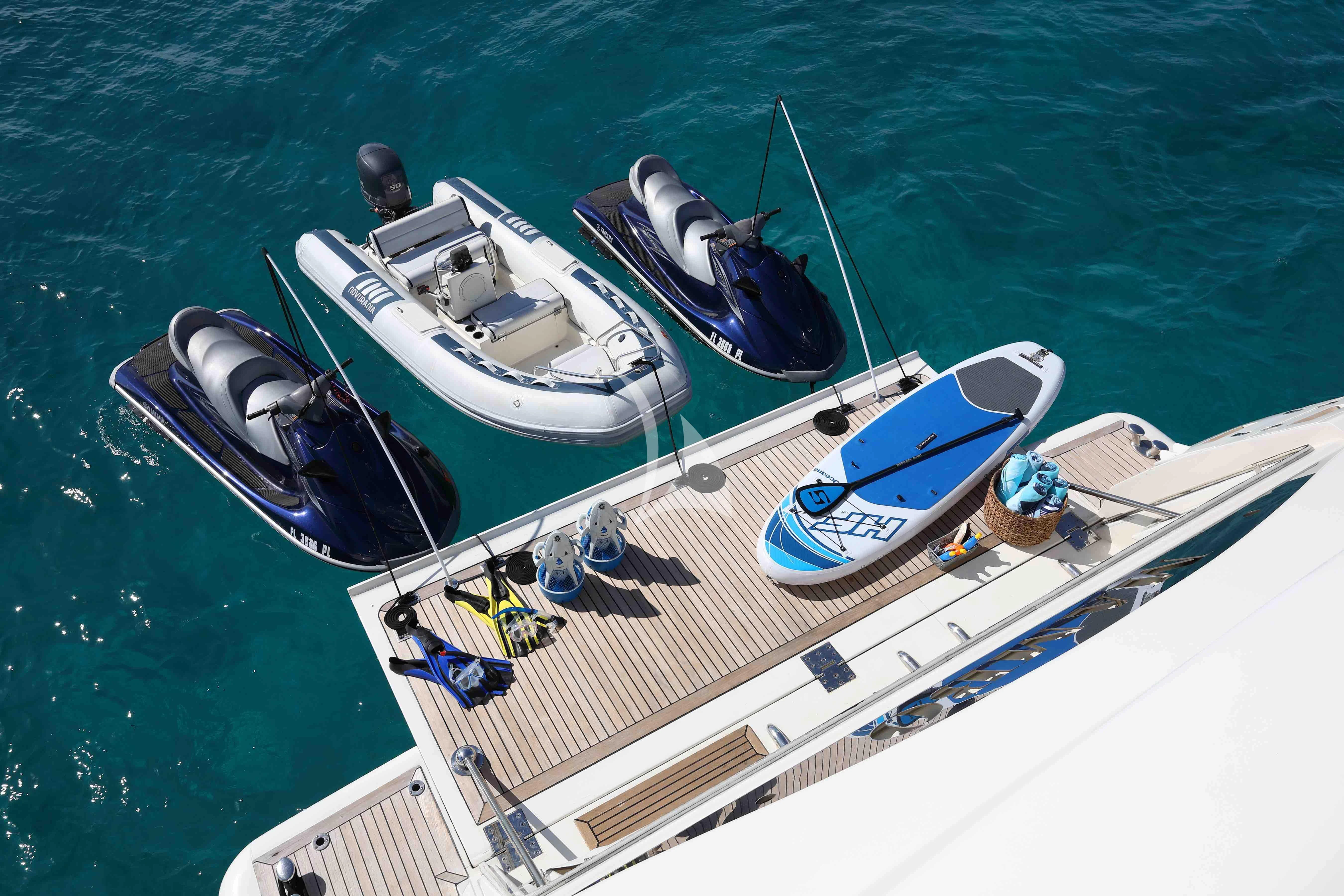 a group of boats on a body of water aboard MAMBO Yacht for Sale