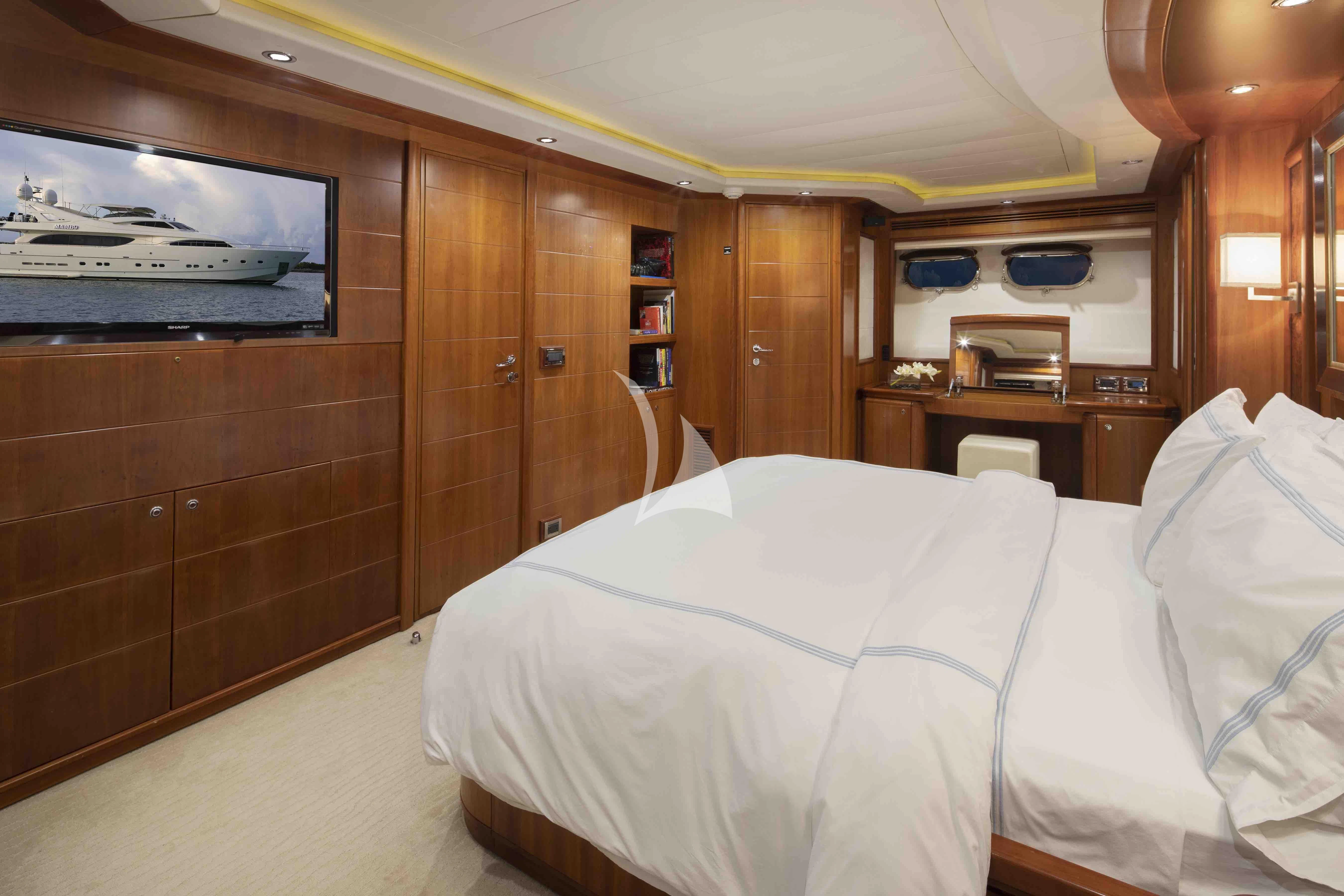 a bed in a room aboard MAMBO Yacht for Sale