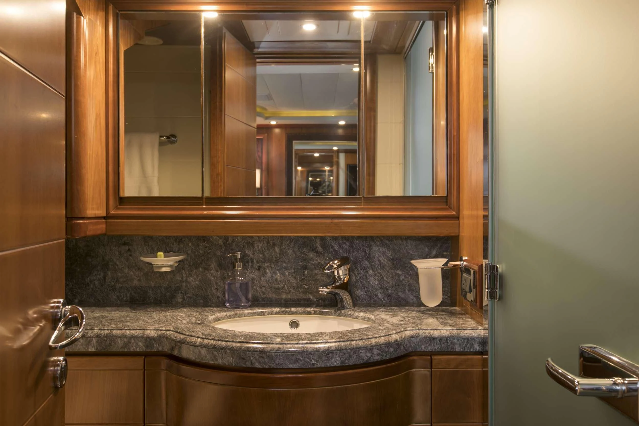 a bathroom with a large mirror aboard MAMBO Yacht for Sale