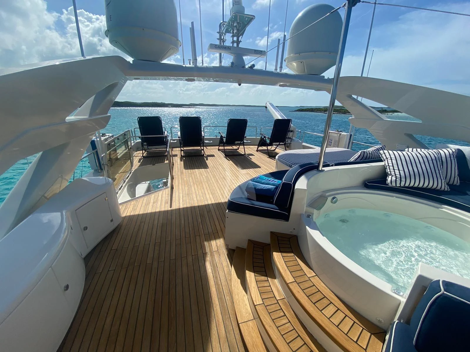 a deck with a large pool aboard MAMBO Yacht for Sale