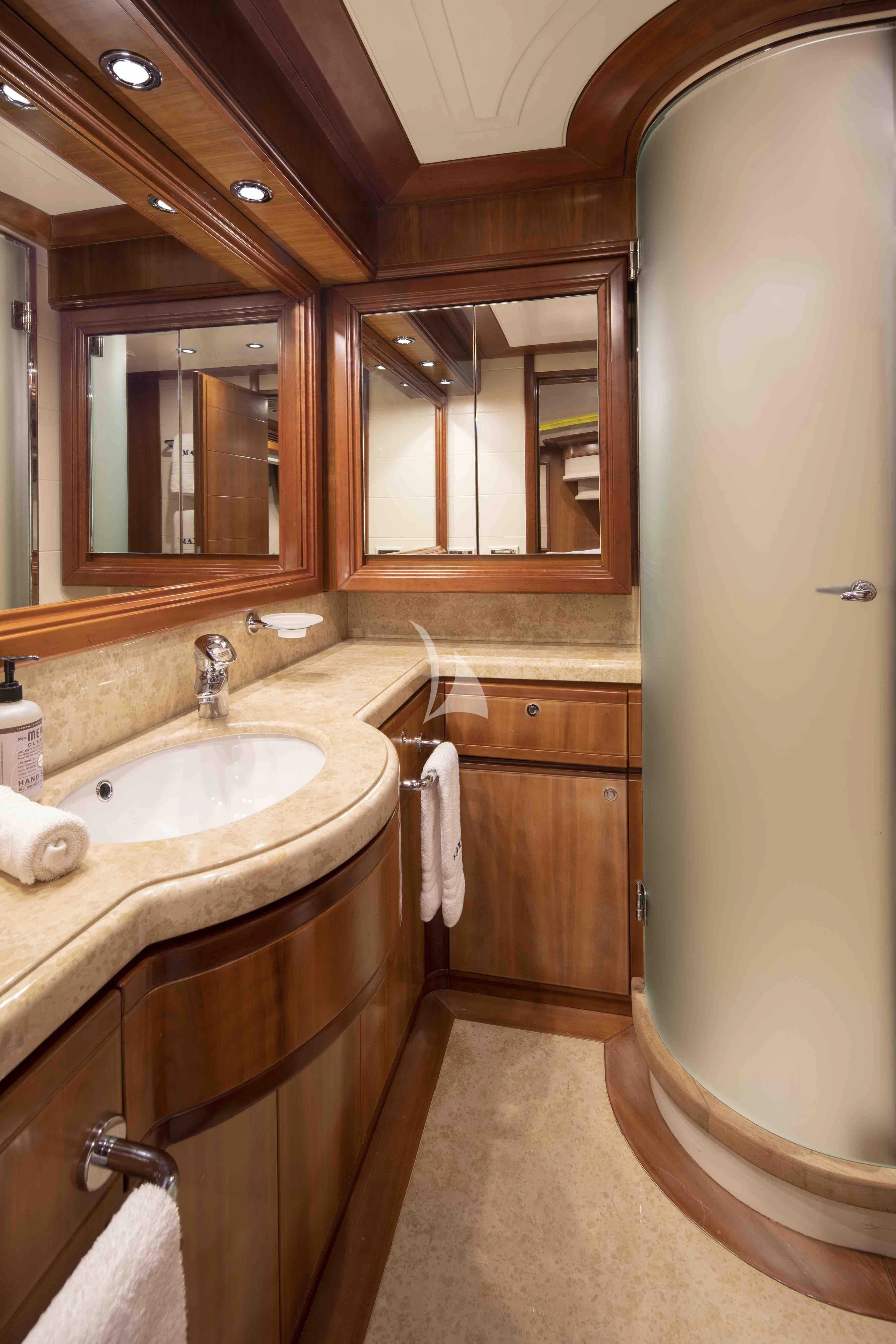 a bathroom with a sink and a mirror aboard MAMBO Yacht for Sale