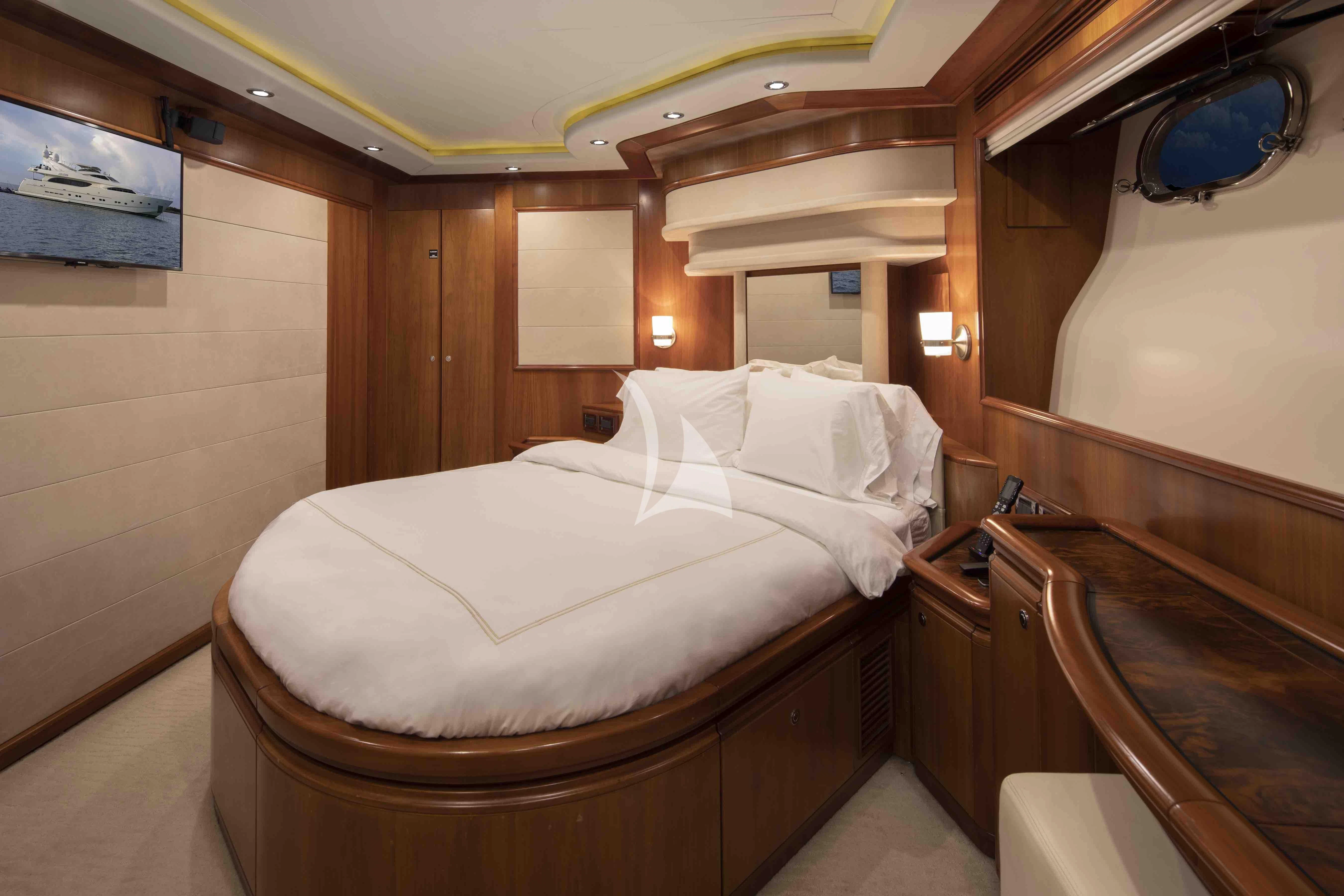 a bed in a room aboard MAMBO Yacht for Sale