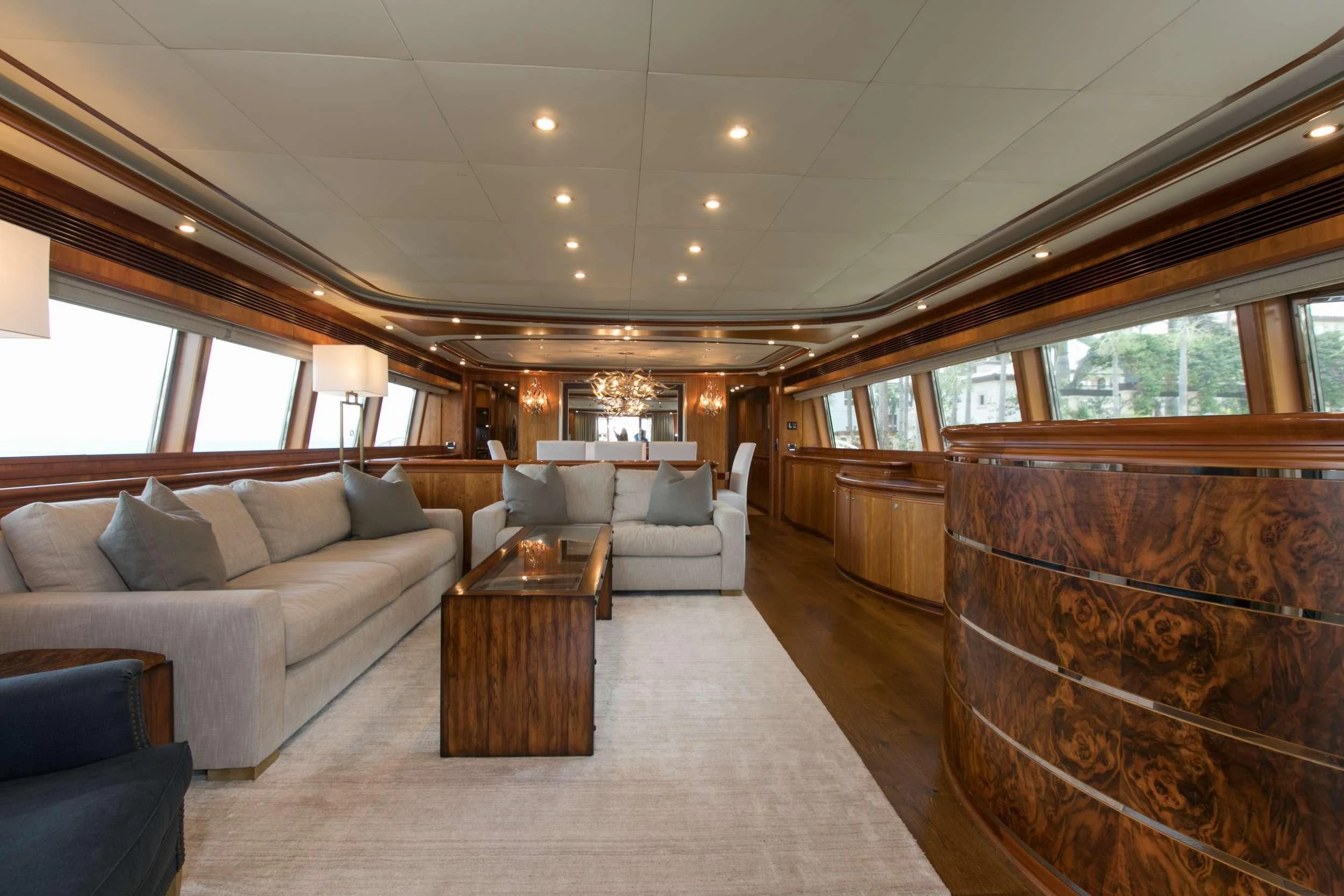 a living room with a couch and a coffee table aboard MAMBO Yacht for Sale