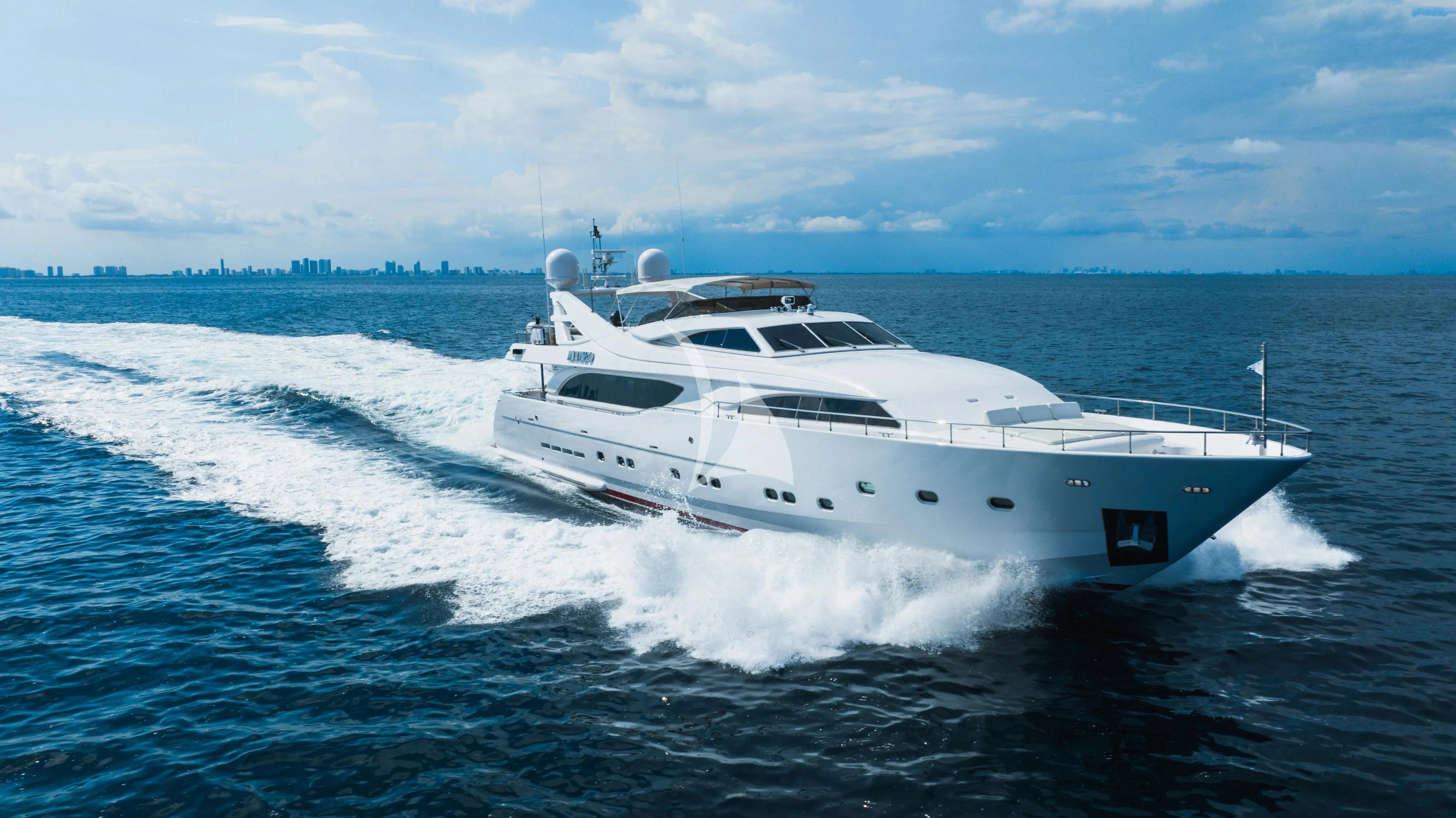 a white yacht on the water aboard MAMBO Yacht for Sale