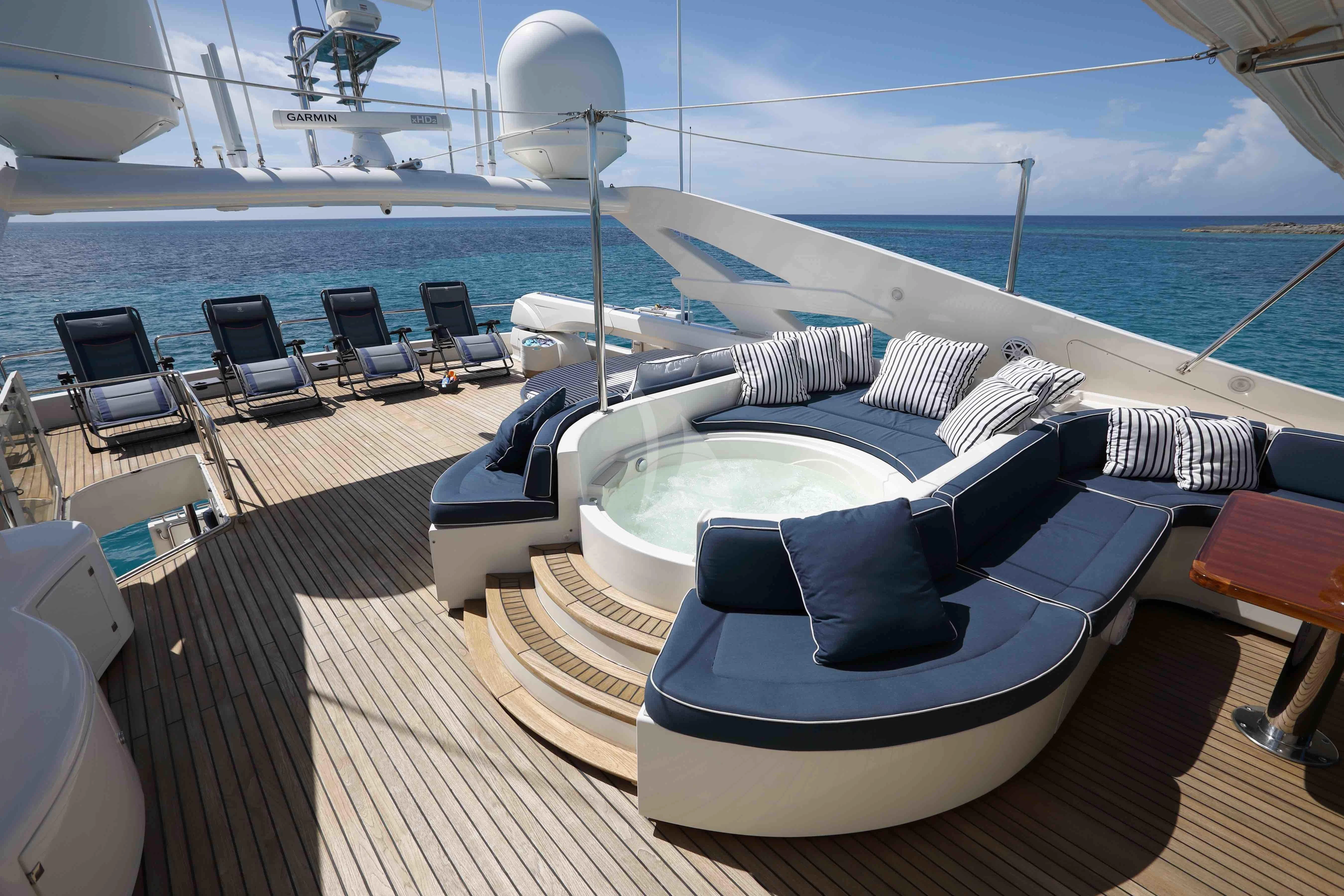 a large pool on a deck aboard MAMBO Yacht for Sale