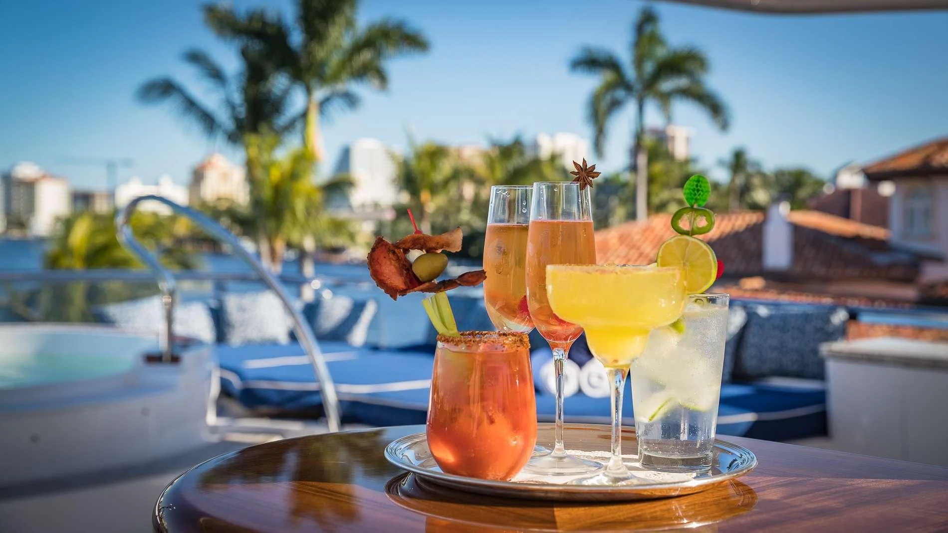 a group of glasses with drinks on a table aboard MAMBO Yacht for Sale