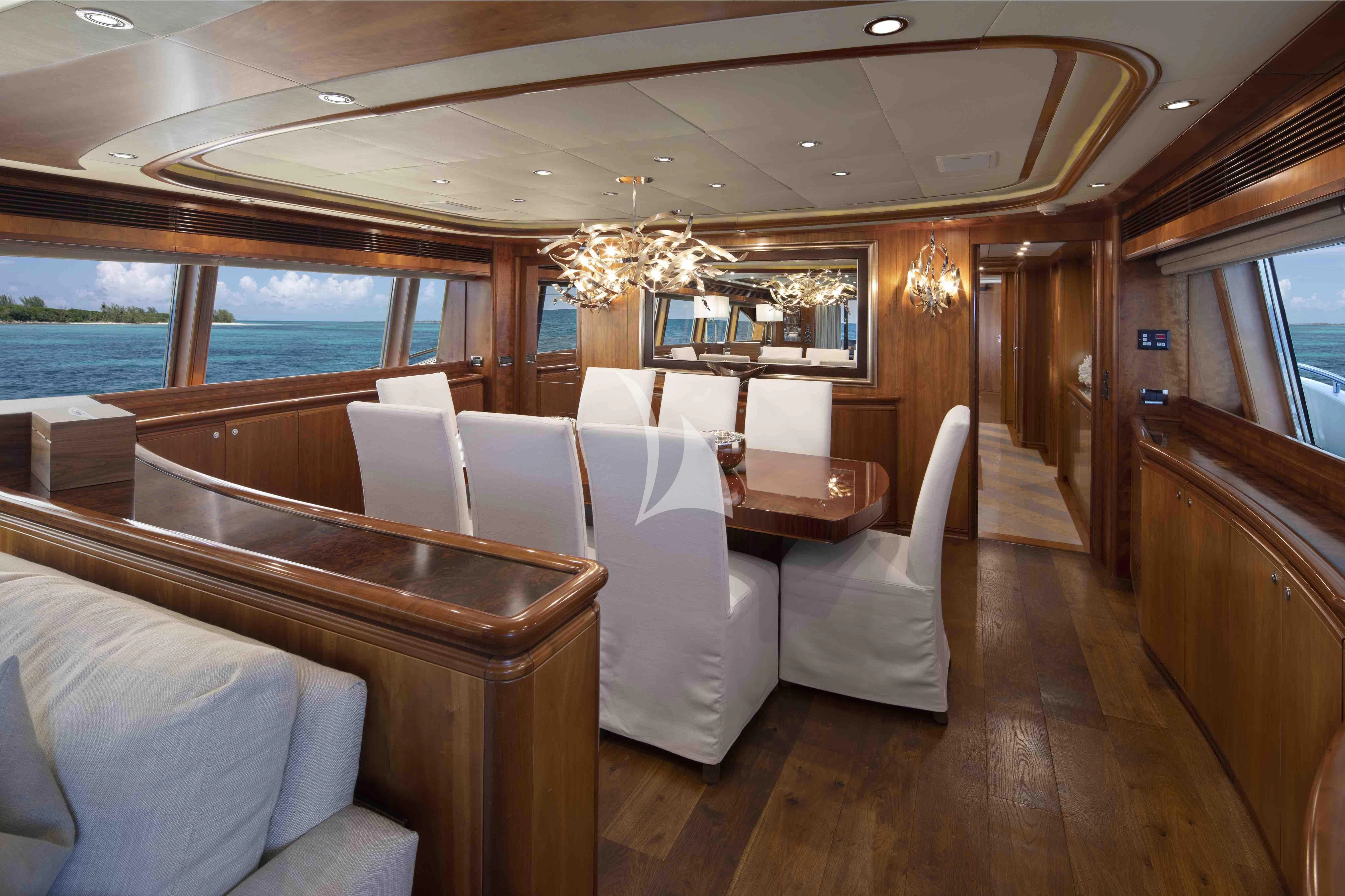 a room with a couch and a table aboard MAMBO Yacht for Sale