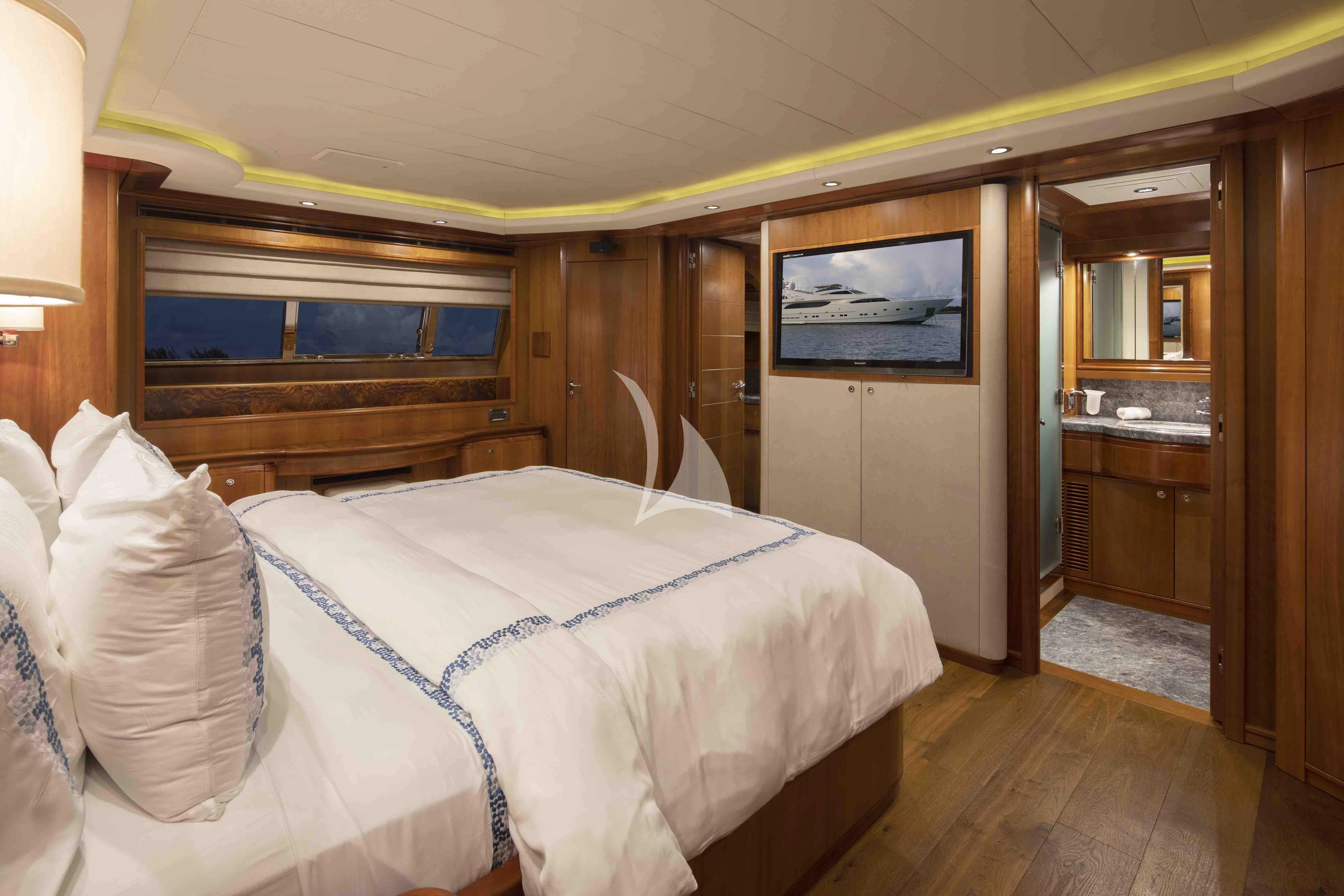 a bedroom with a bed aboard MAMBO Yacht for Sale