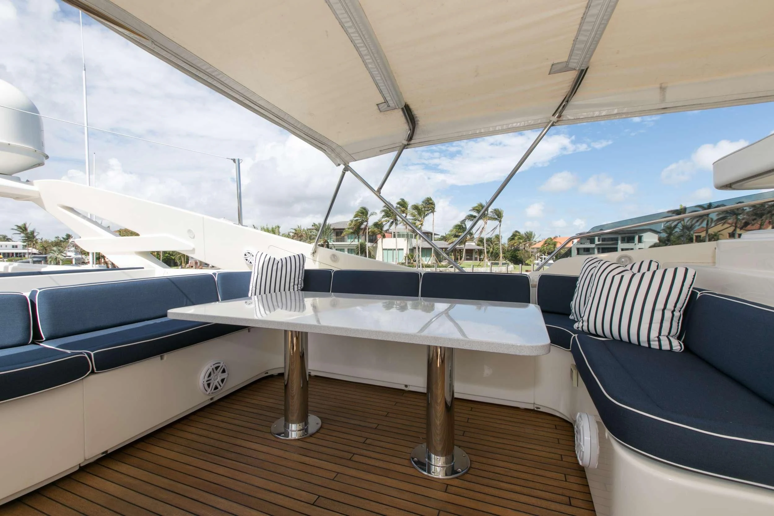 a table on a deck aboard MAMBO Yacht for Sale