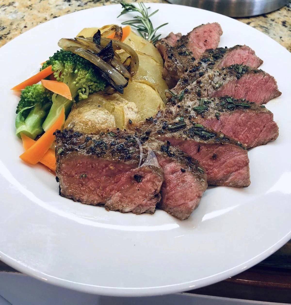 a plate of food aboard MAMBO Yacht for Sale