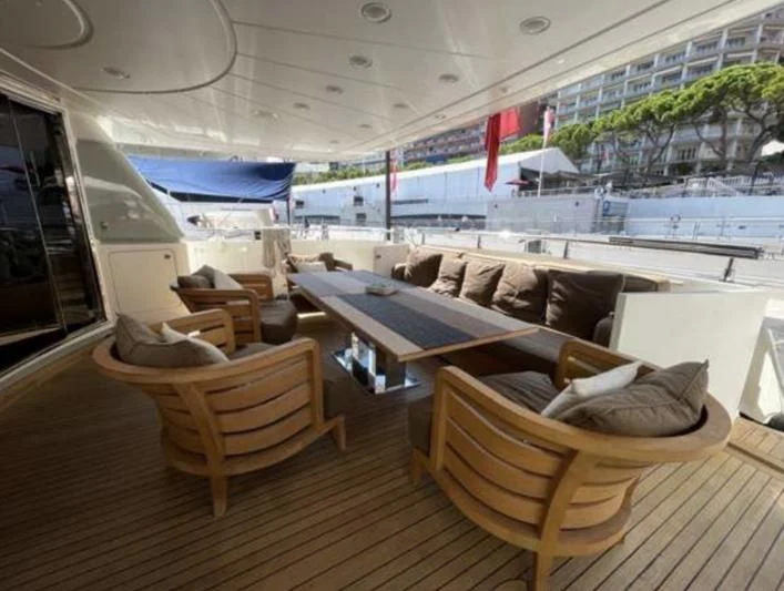 a boat with a couch and chairs aboard ELAN Yacht for Sale