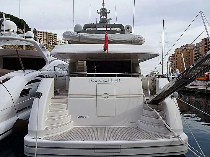 a white boat with a red stripe on the front aboard ELAN Yacht for Sale