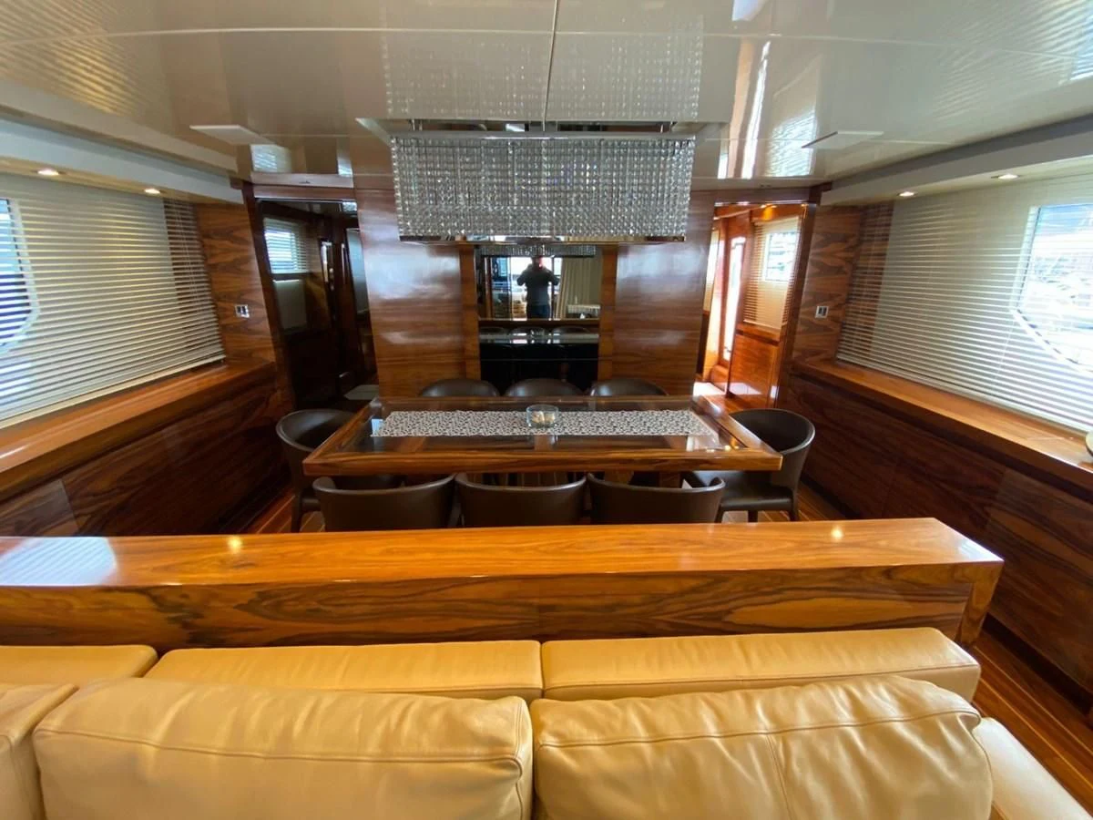a room with a couch and a table aboard ELAN Yacht for Sale