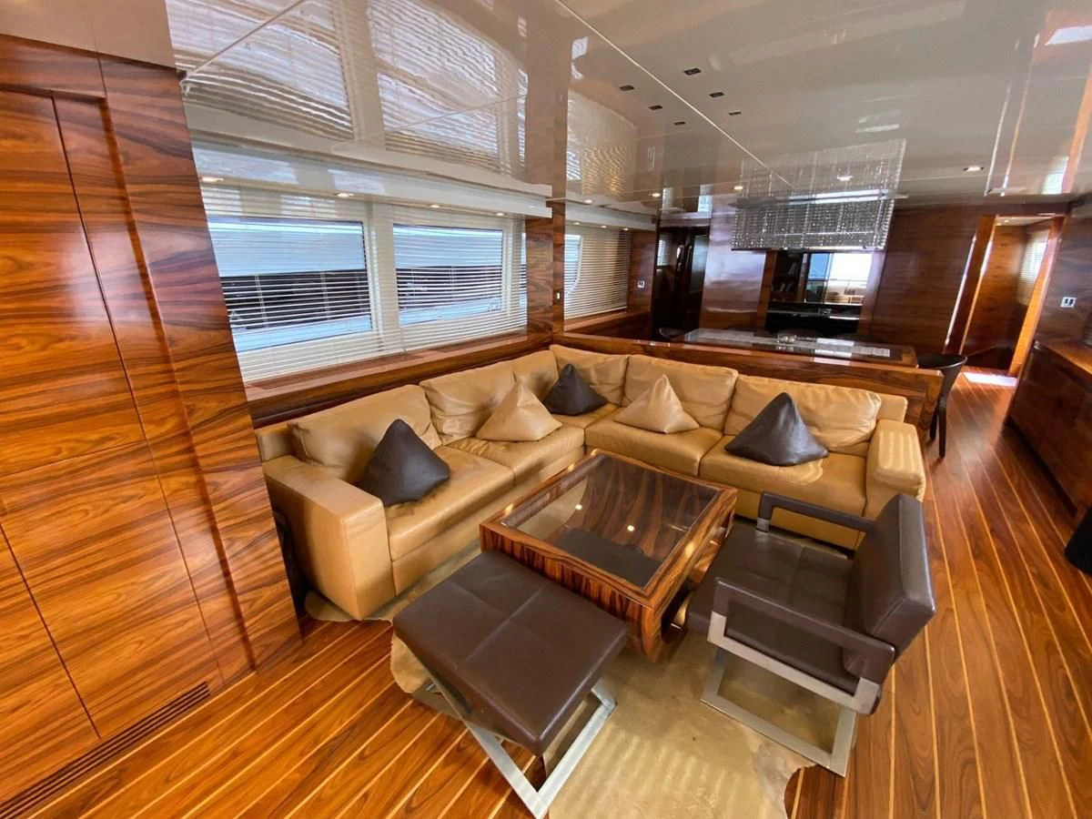 a living room with a wood floor aboard ELAN Yacht for Sale