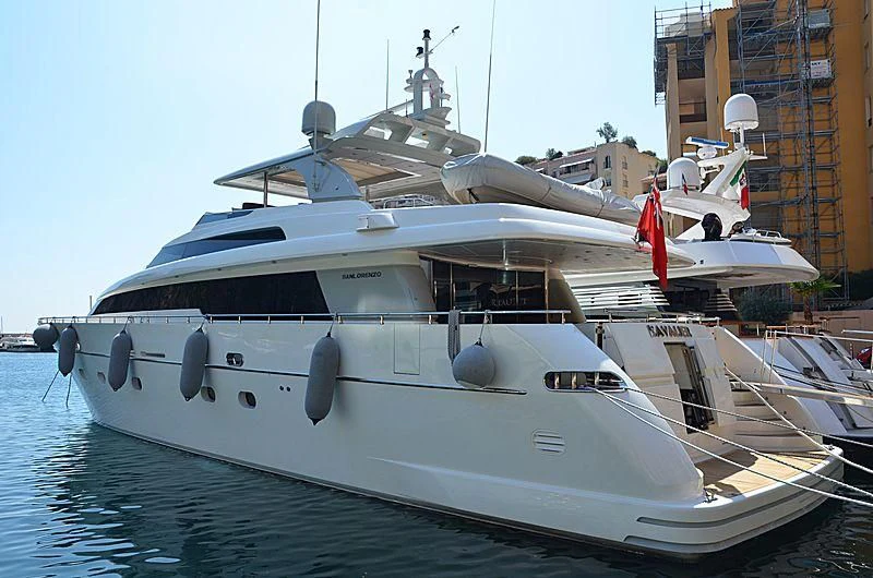a large white yacht docked aboard ELAN Yacht for Sale