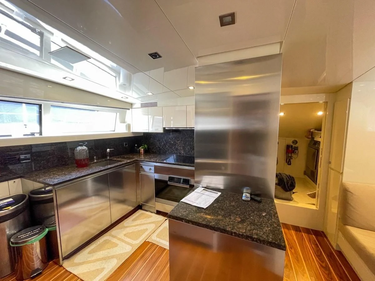 a large kitchen with a large glass shower aboard ELAN Yacht for Sale