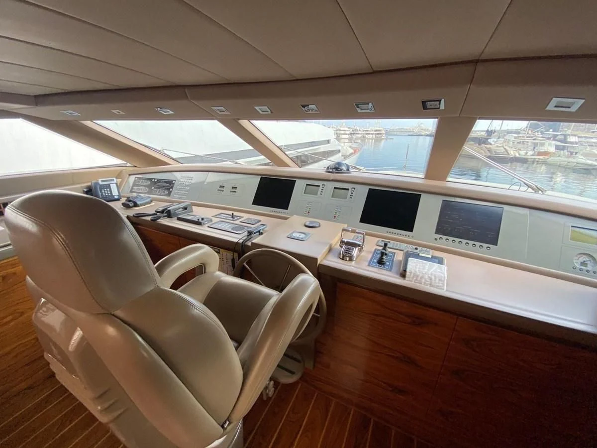 a room with a desk and chairs aboard ELAN Yacht for Sale