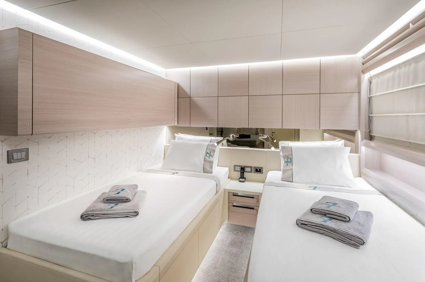 a white kitchen with white cabinets aboard PROJECT 105 Yacht for Sale