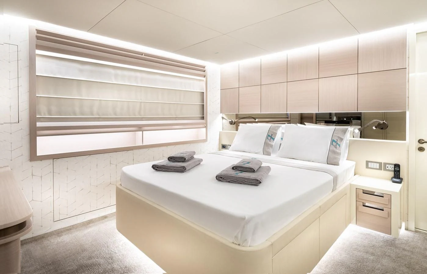 a room with a desk and a bed aboard PROJECT 105 Yacht for Sale