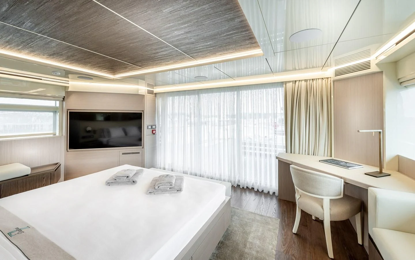 a room with a table and chairs aboard PROJECT 105 Yacht for Sale